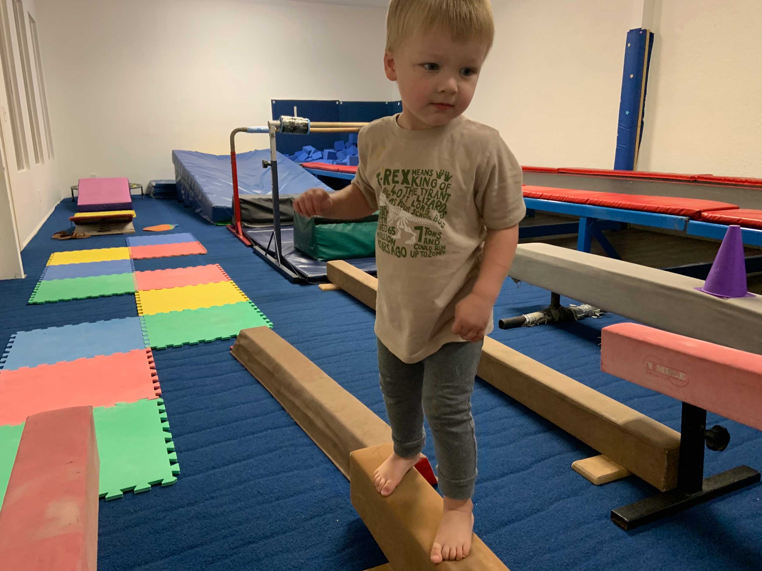 Preschool boy on a balance beam Preschool boy on a balance beam